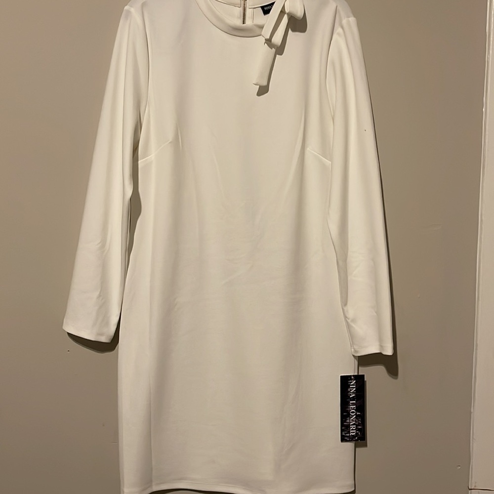 Brand new dress with tie detail.